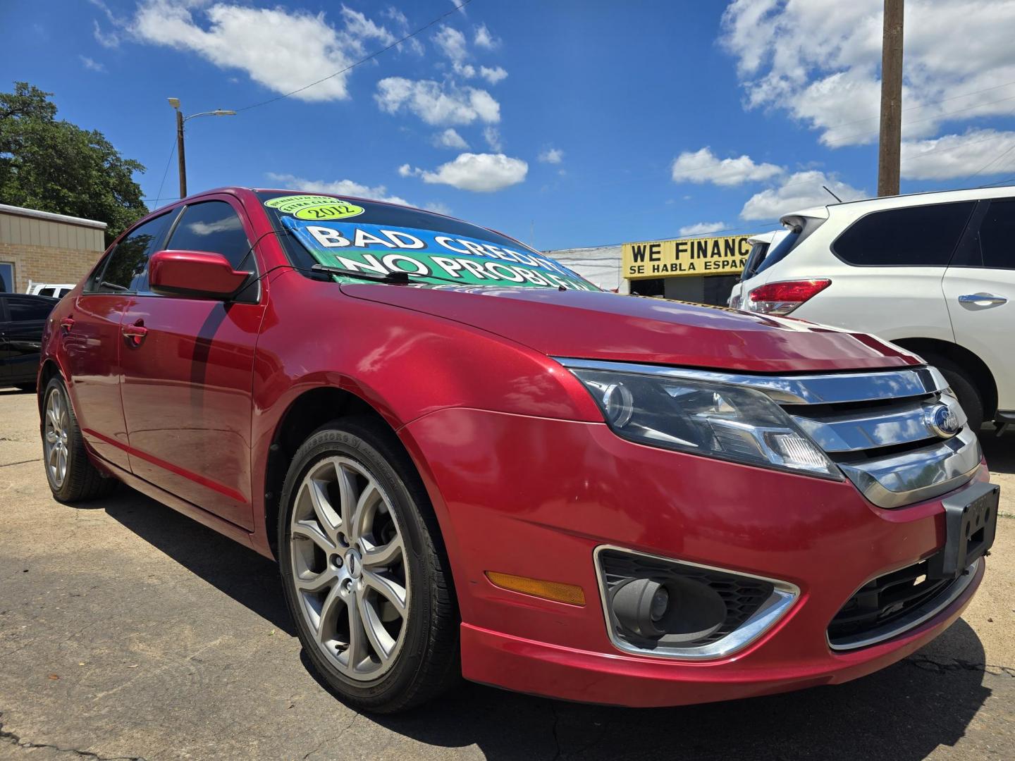 2012 RED Ford Fusion SE (3FAHP0HA8CR) with an 2.5L L4 DOHC 16V engine, AUTO transmission, located at 2660 S.Garland Avenue, Garland, TX, 75041, (469) 298-3118, 32.885387, -96.656776 - Photo#1